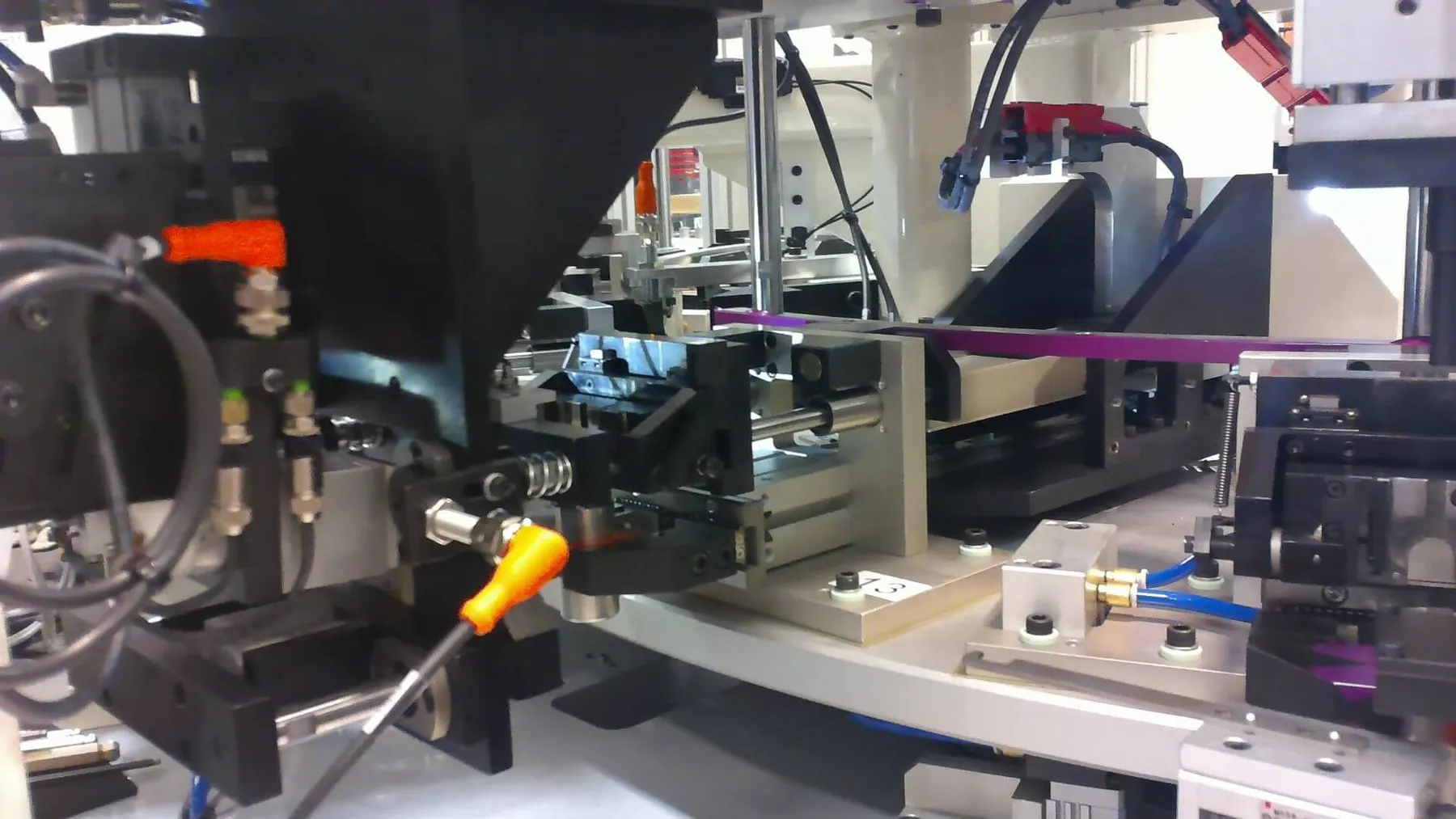 Automated micro assembly station with a wire fed to a fixture