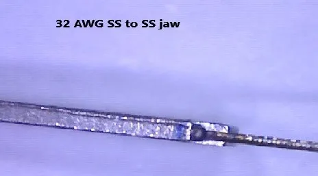 Magnified weld of 32 AWG stainless steel wire to a stainless steel jaw