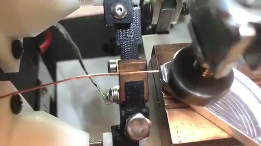 Slow motion: 22 AWG bare copper wire percussion welded to a 0.100" thick aluminum lid.