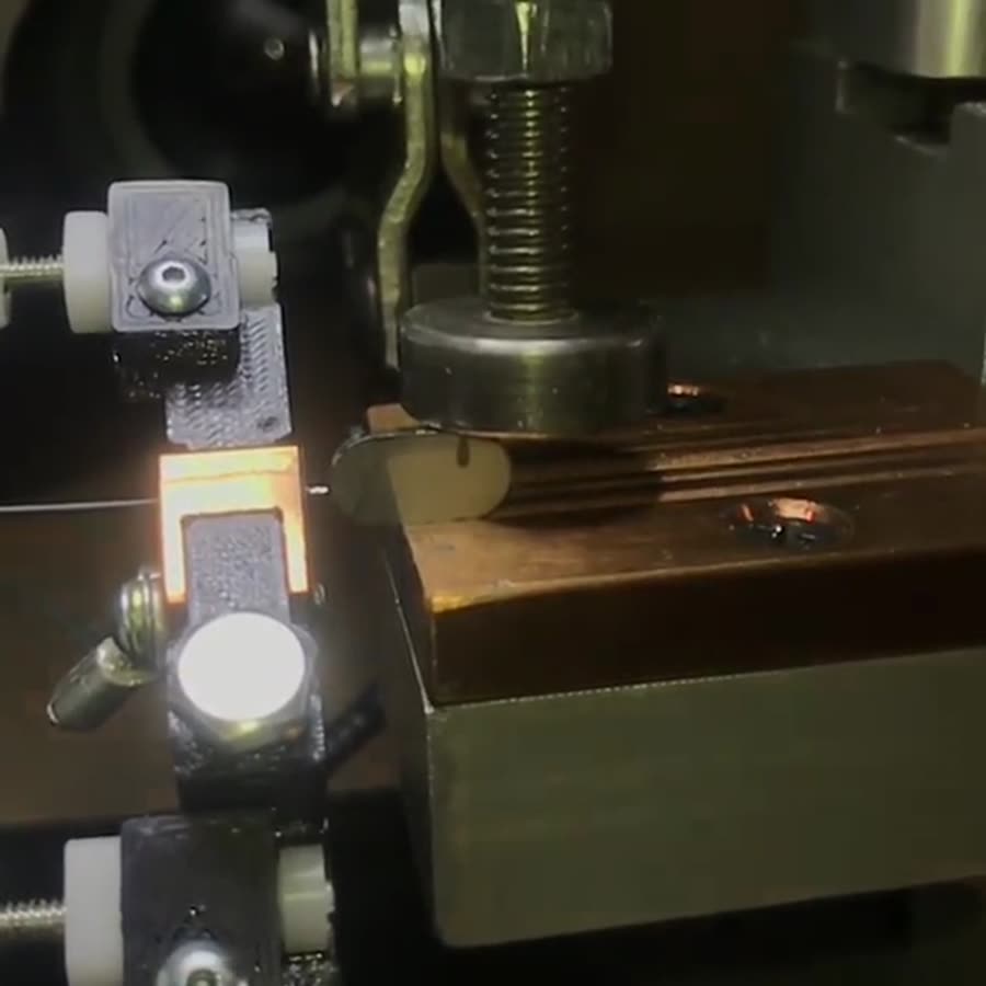 Slow motion: copper wire percussion welded to a piece of stainless steel.