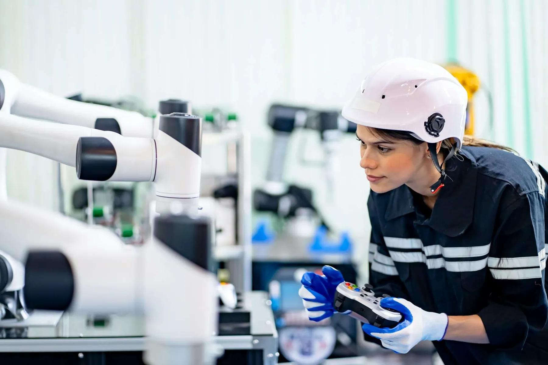 Indusrtial Robot, Engineers inspecting and check up welding robots at factory.